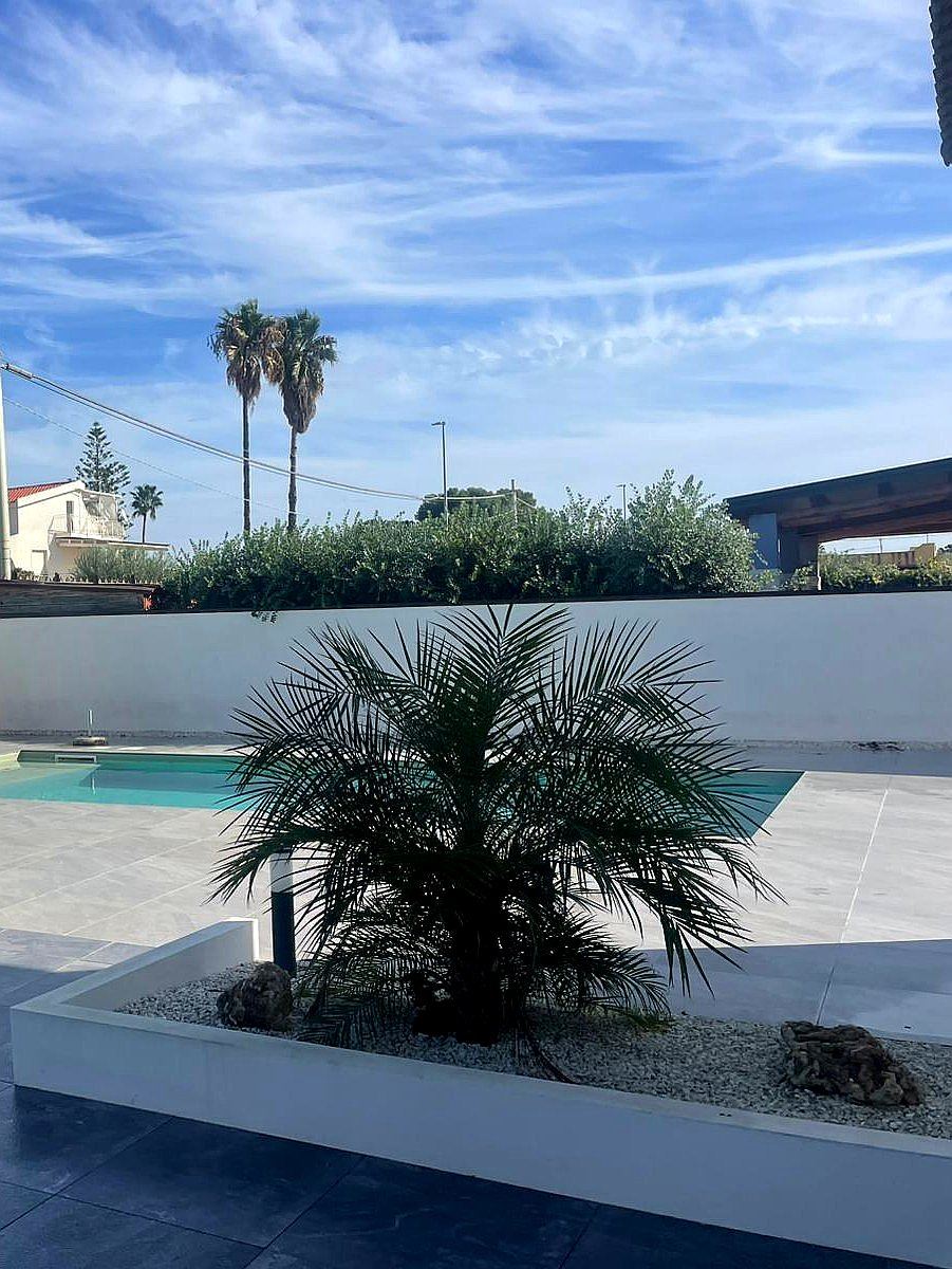 Comfortable outdoor lounge seating under the Sicilian sky